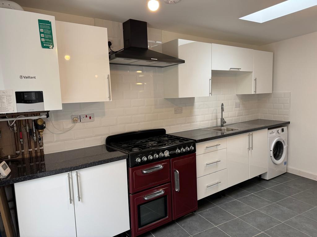 This modern kitchen features a stylish design w...