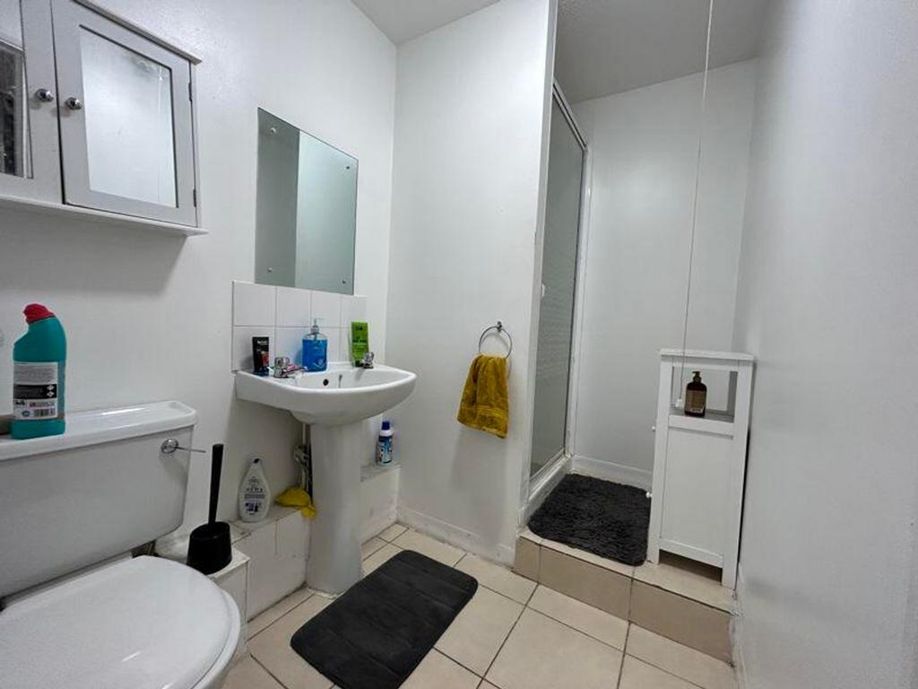 A bright and tidy bathroom featuring modern fix...