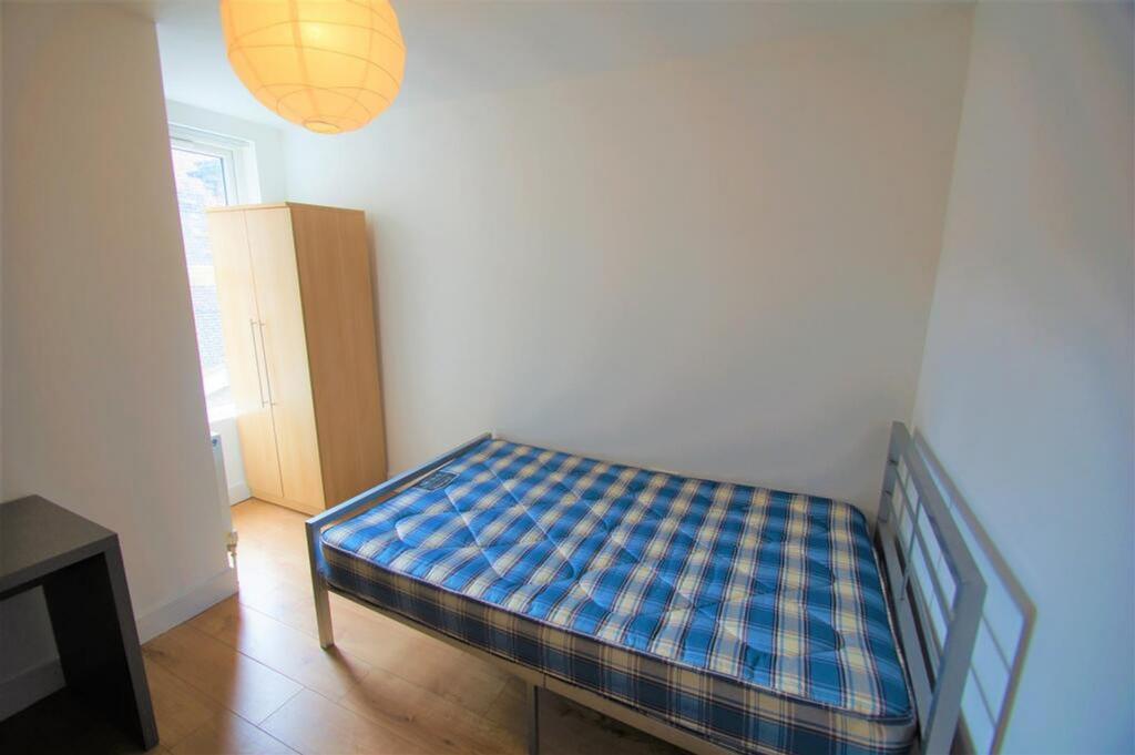 A bright and inviting double bedroom featuring ...