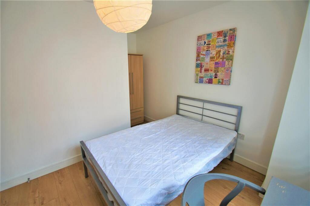 Cozy double bedroom featuring a comfortable bed...