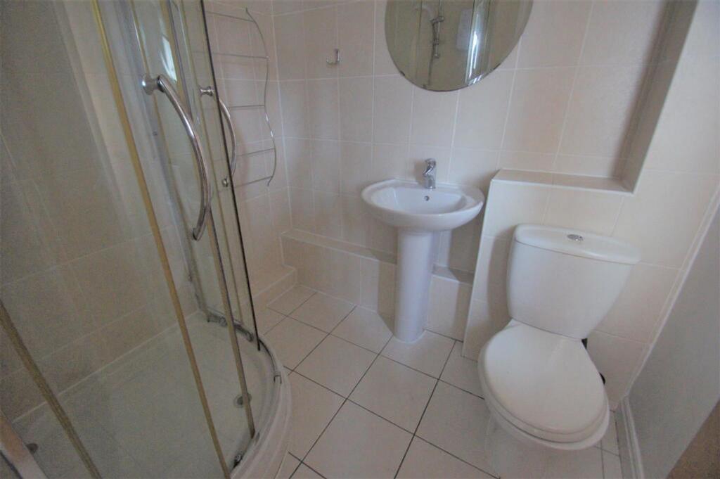 A well-maintained bathroom featuring a modern s...