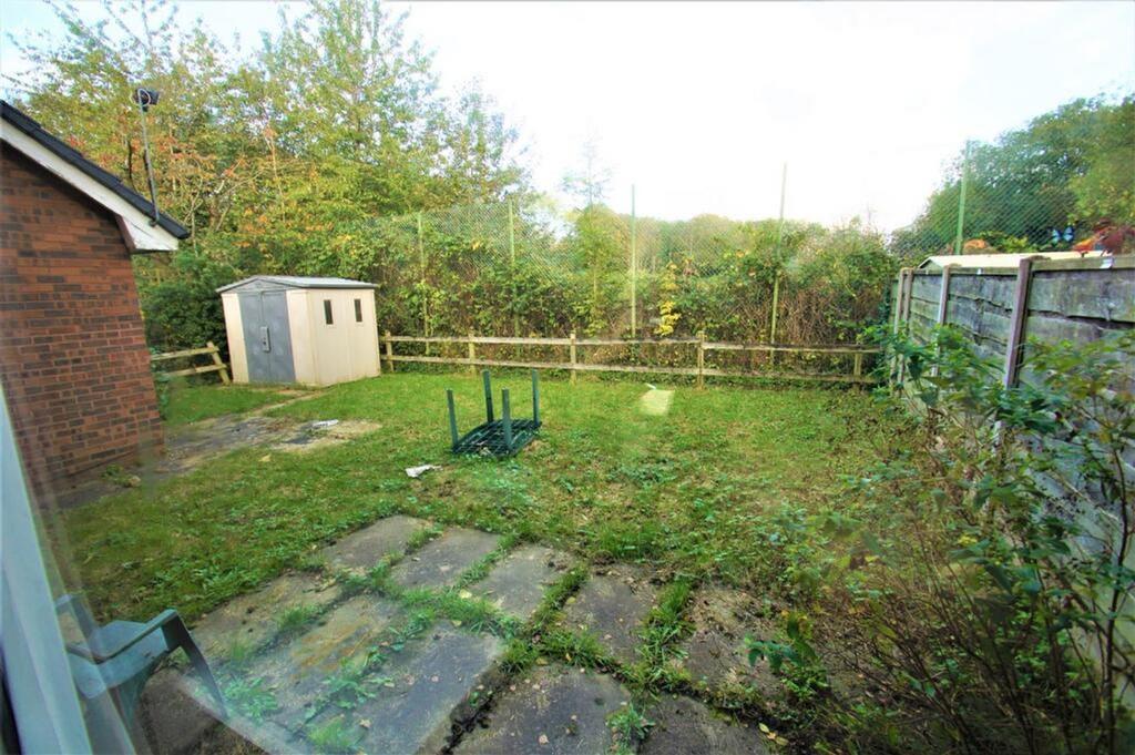 A charming garden space featuring a well-mainta...