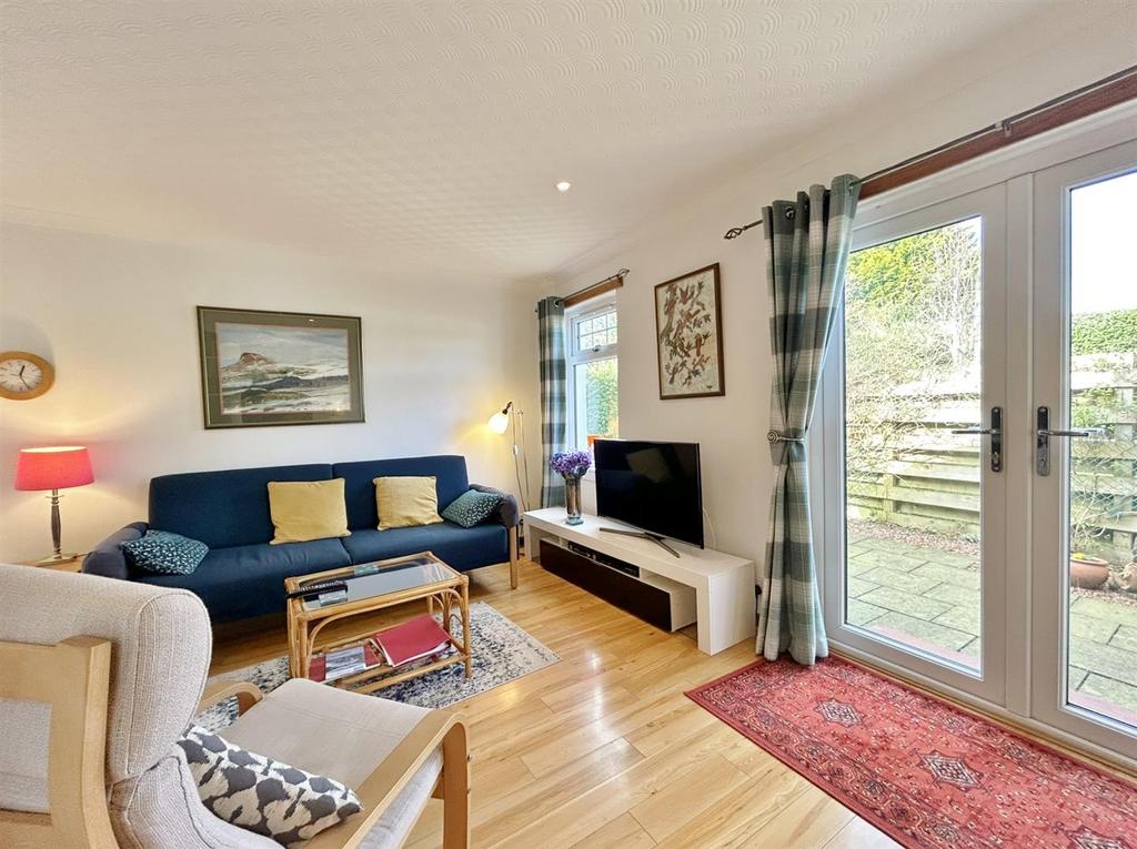 Open plan lounge showing French doors
