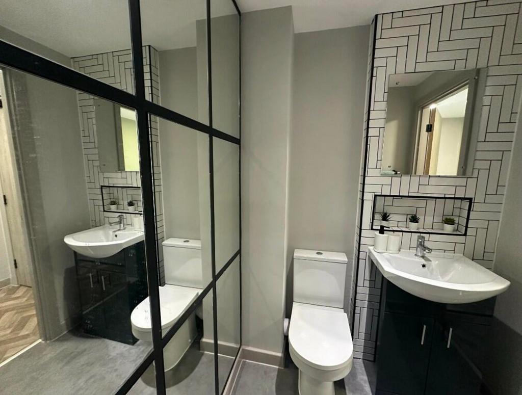 A modern and stylish bathroom featuring sleek f...