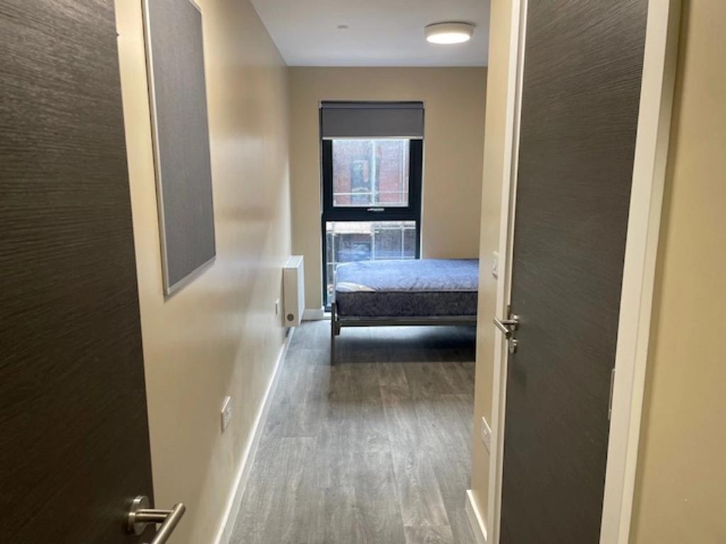 Bright and inviting single bedroom featuring mo...