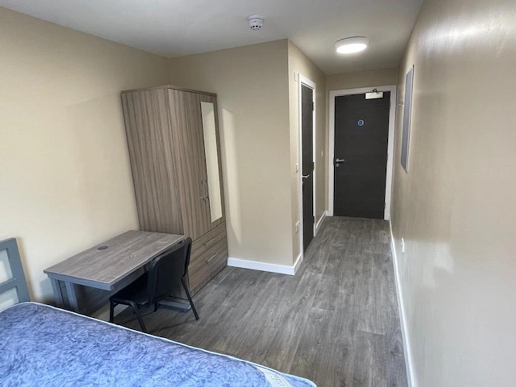 This inviting double bedroom features a comfort...