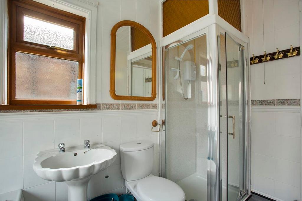 Bright and modern bathroom featuring a stylish ...