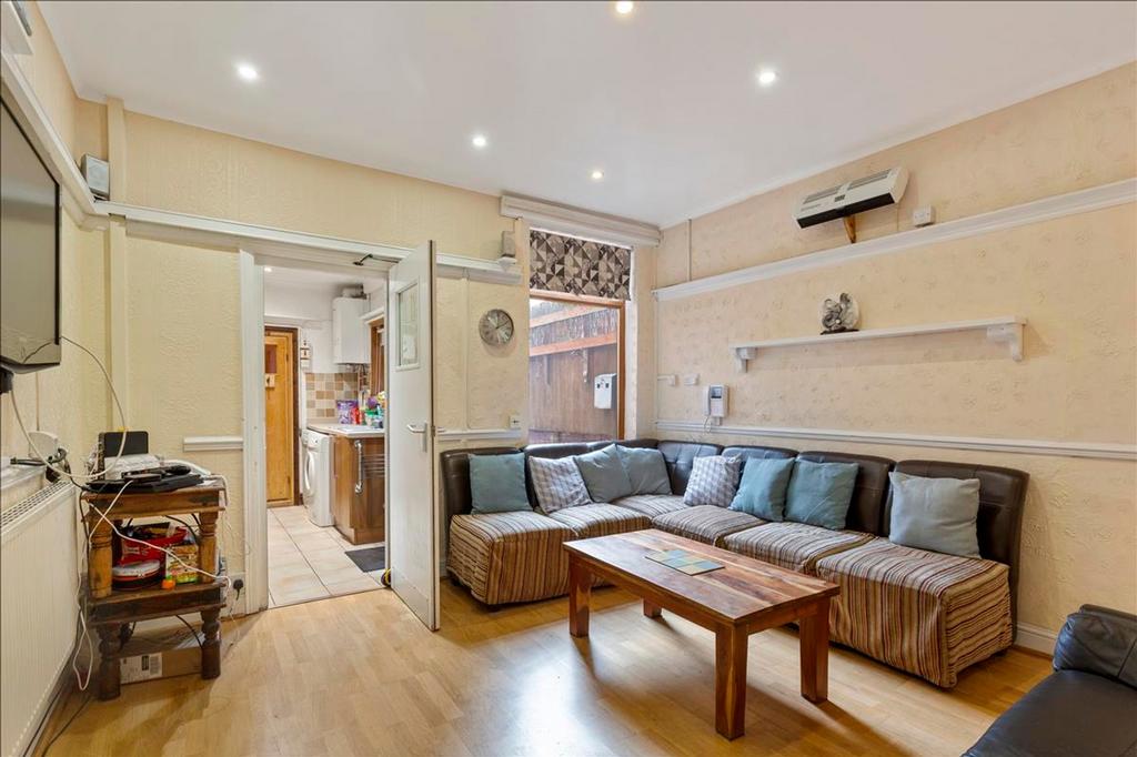 A spacious and inviting living room adorned wit...