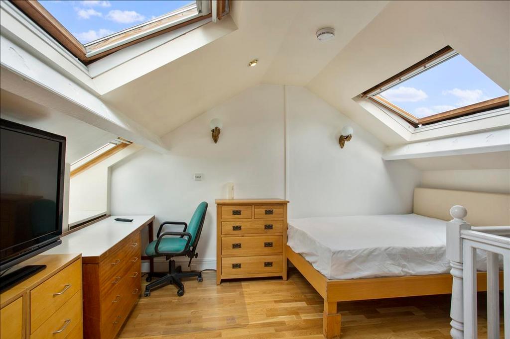 This charming double bedroom features ample nat...
