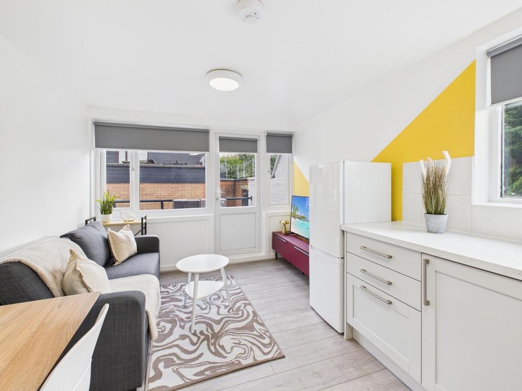Bright, well-presented living area with large w...