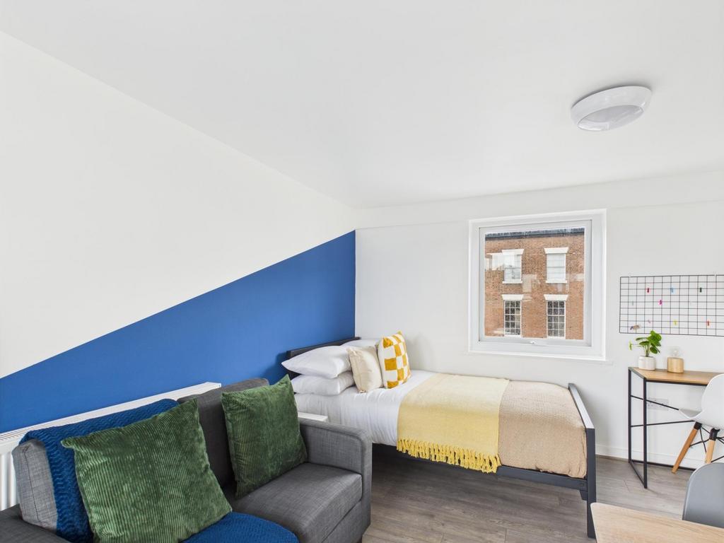 Bright, modern bedroom with a comfortable doubl...