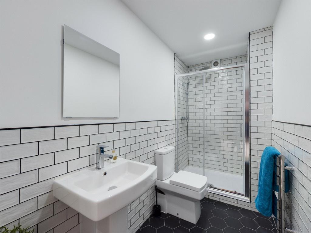A modern, well-maintained bathroom with a spaci...