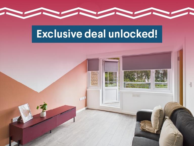 Bright and inviting living room featuring large...