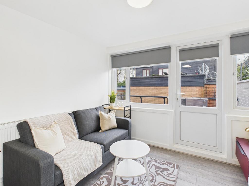 Bright, modern living room with a comfortable d...
