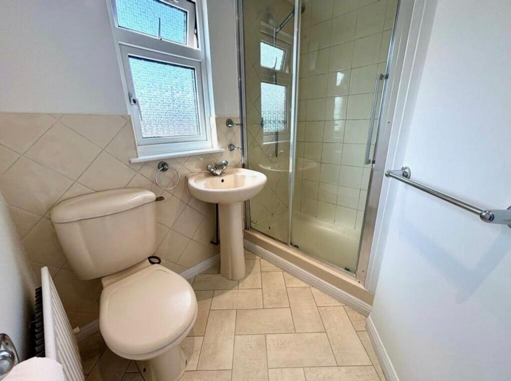 A bright and clean bathroom featuring a modern ...