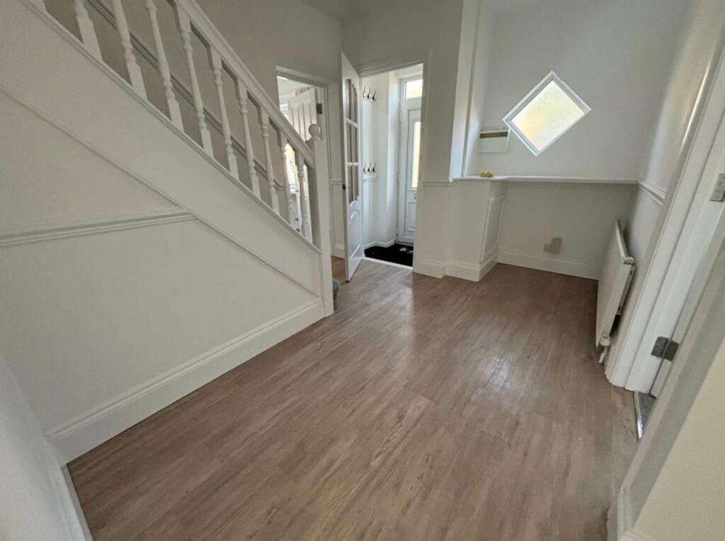 A bright and inviting hallway with modern decor...