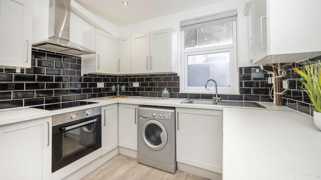 A modern and stylish kitchen with sleek finishe...