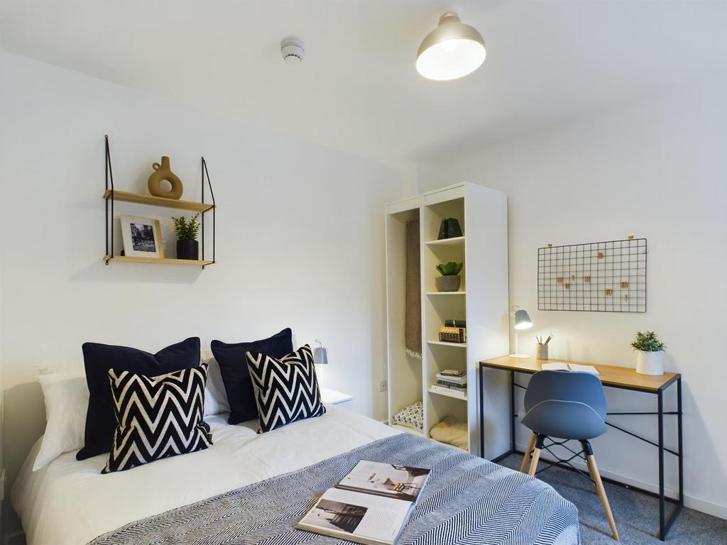 A stylish and inviting double bedroom featuring...