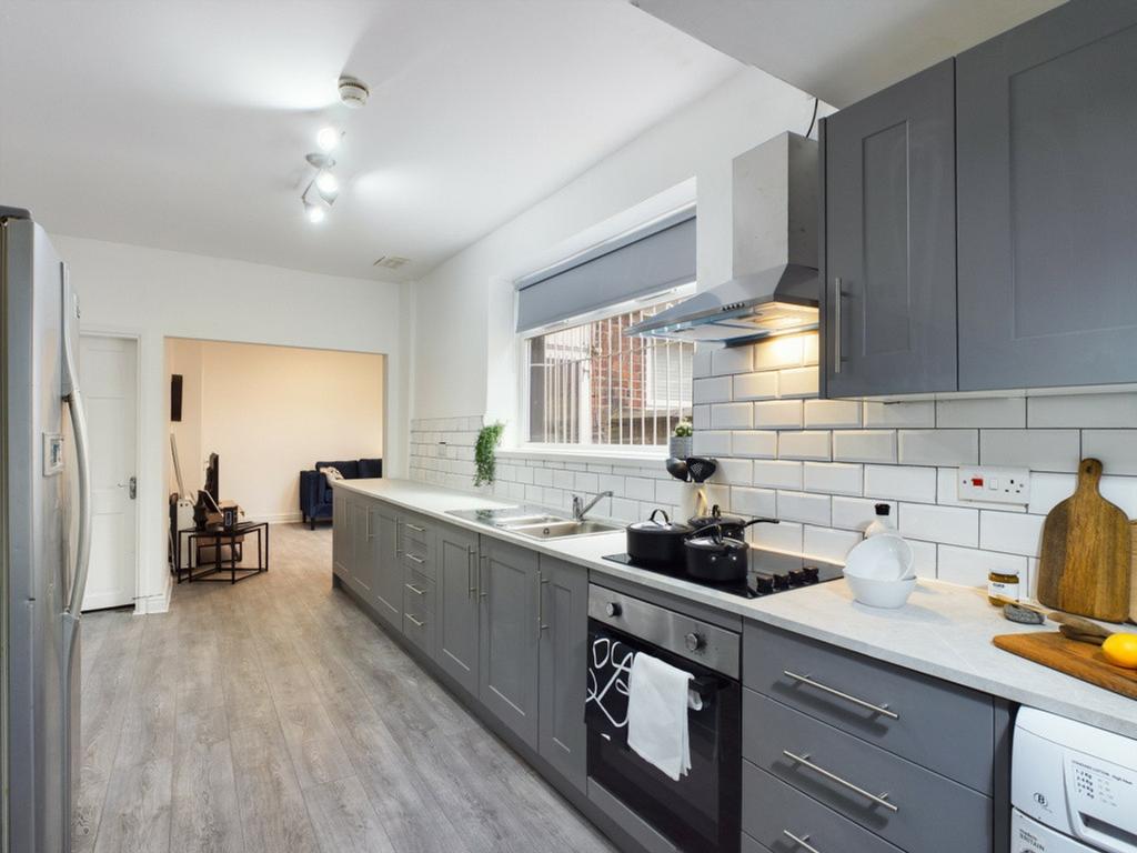 A modern and inviting kitchen, featuring ample ...