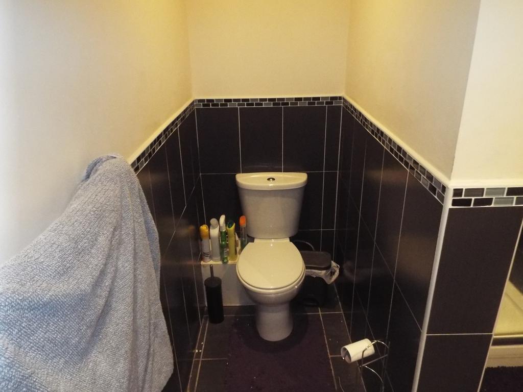 A well-maintained single toilet area featuring ...
