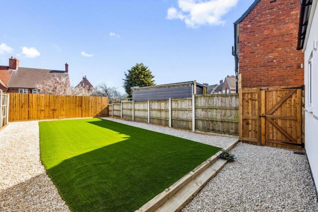 Beautifully landscaped garden featuring lush ar...