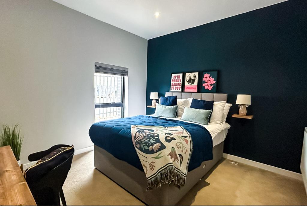 A well-decorated double bedroom with a comforta...