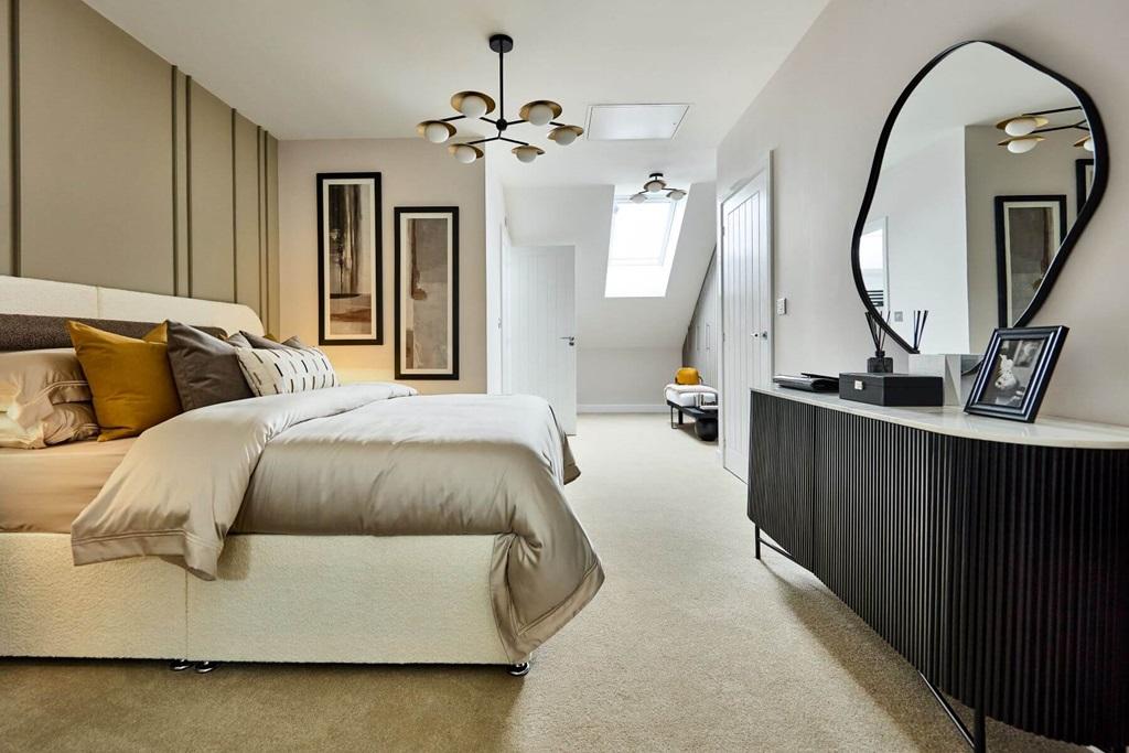 The show stopping main bedroom features a...