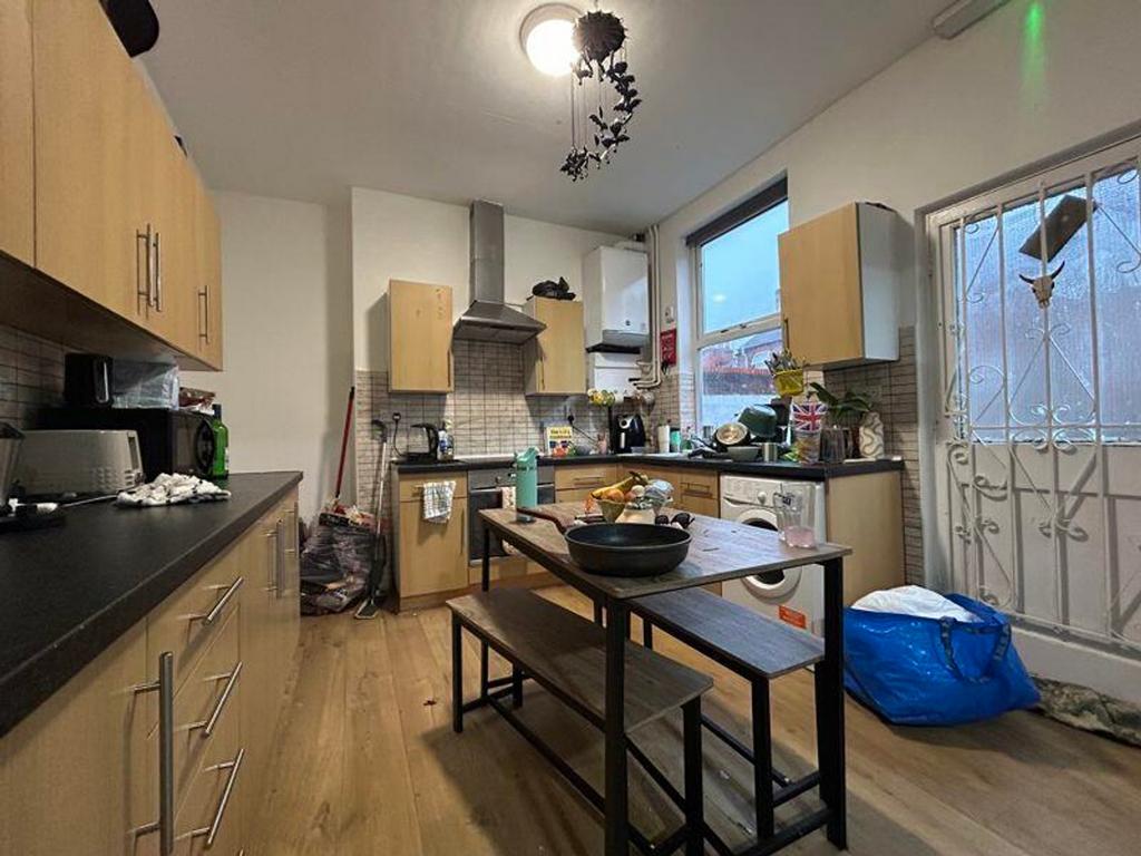 A spacious and functional kitchen with ample st...