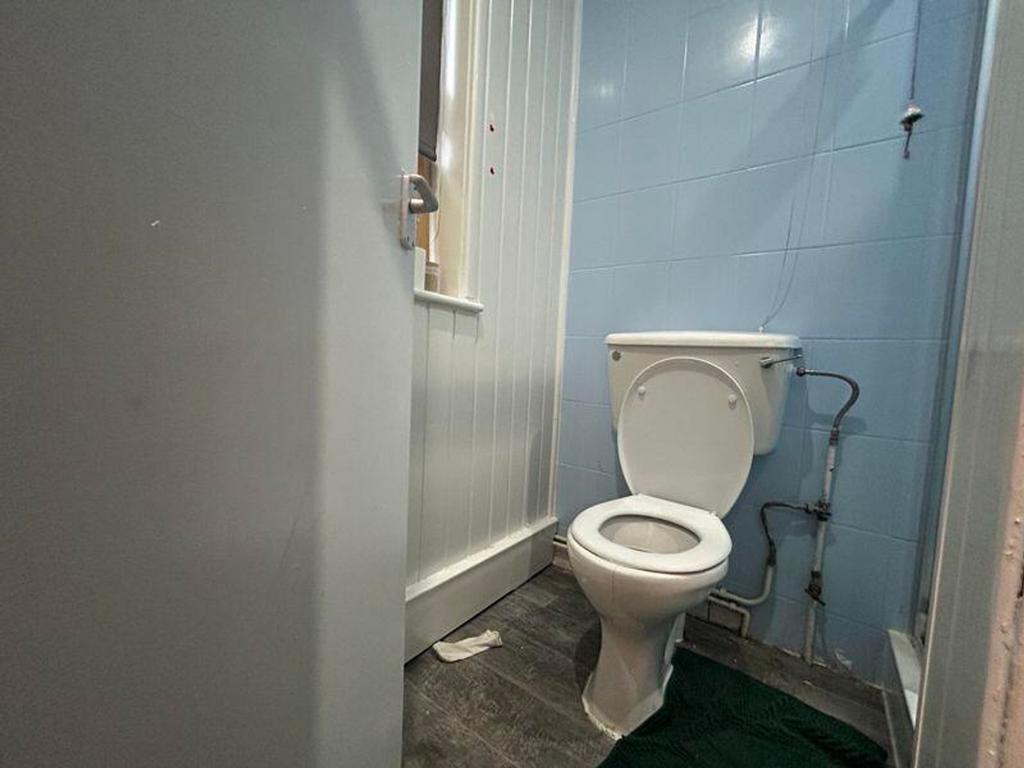 A functional single toilet with a clean design,...