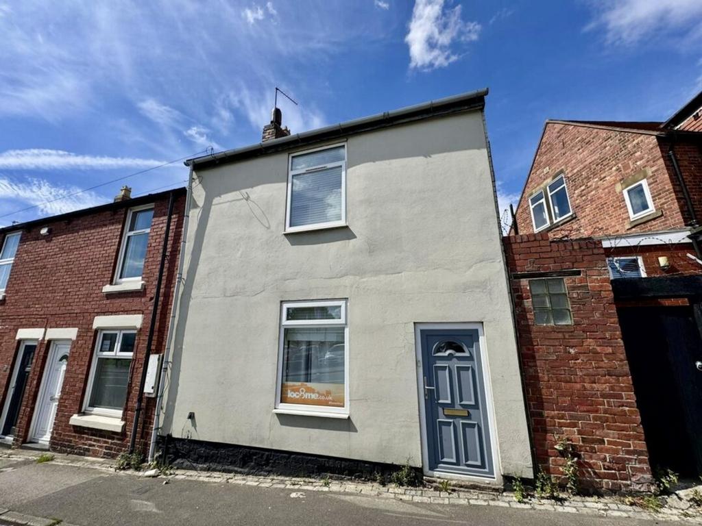A charming exterior view of the property featur...