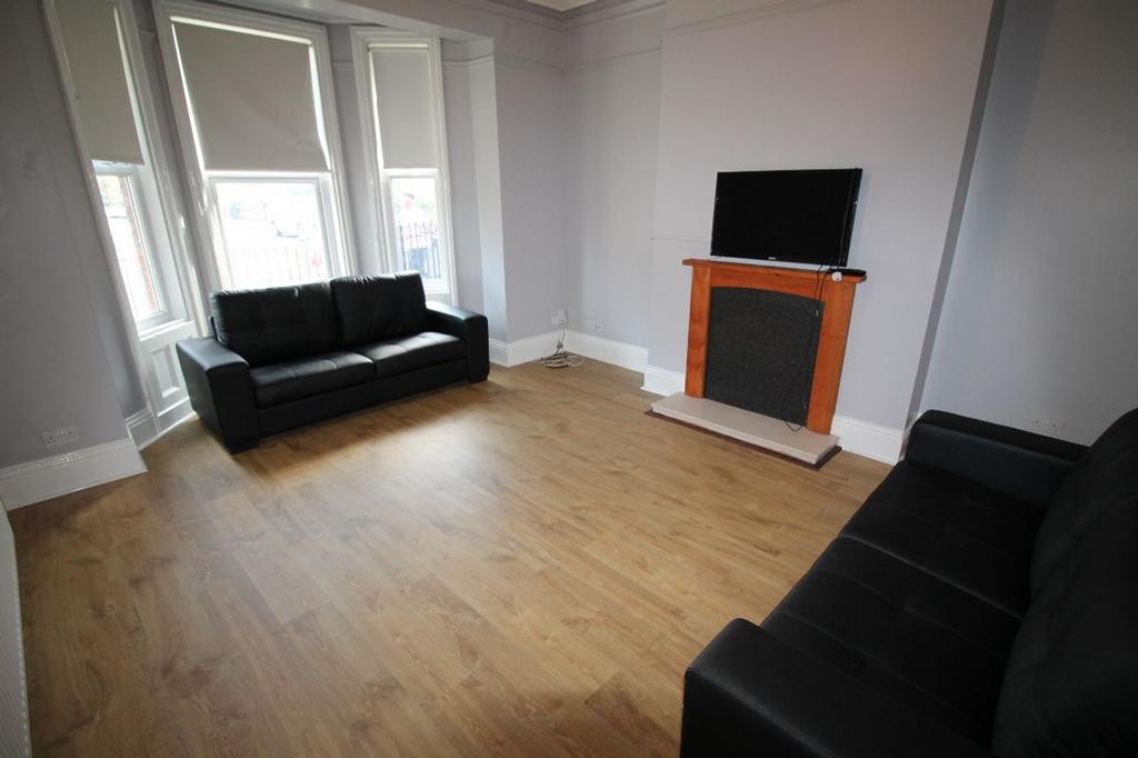 A spacious and inviting living room featuring c...