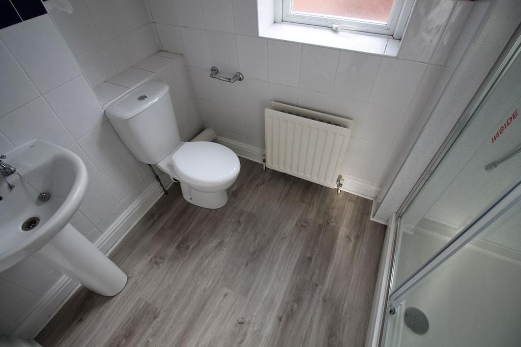 Bright and modern bathroom featuring a clean sh...