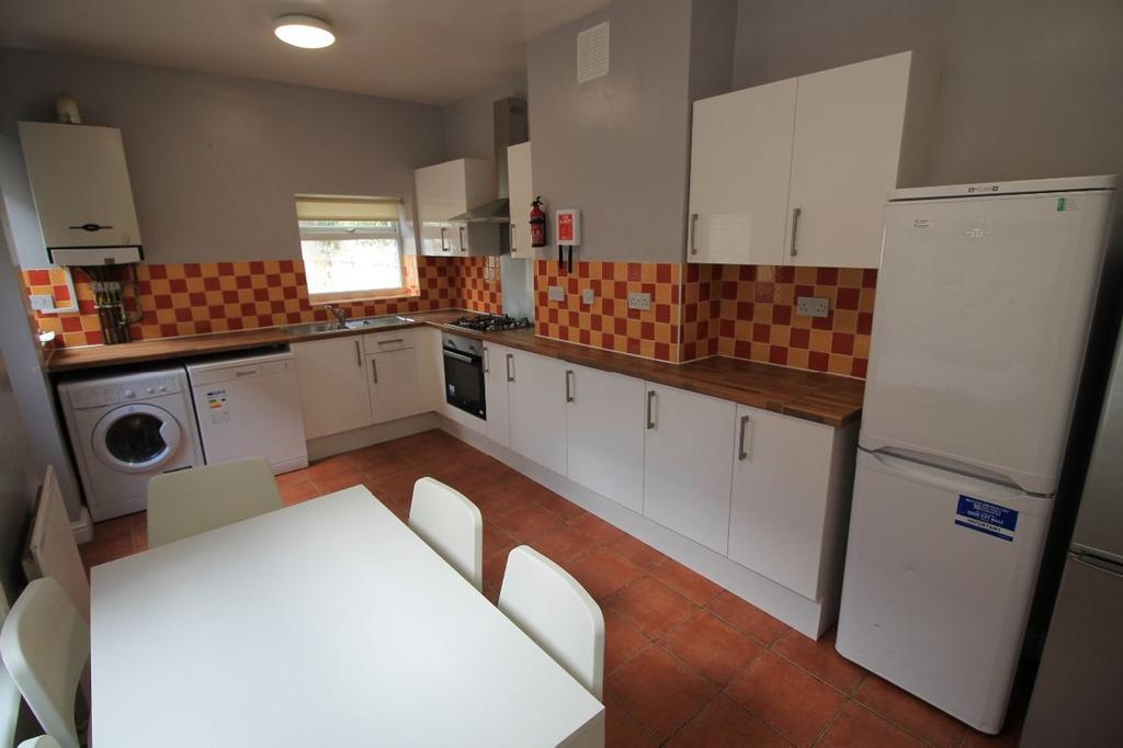 This spacious kitchen is designed for convenien...