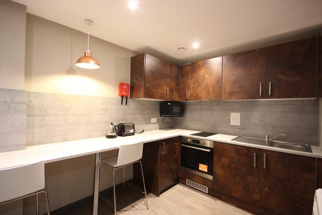 A modern and clean kitchenette featuring stylis...