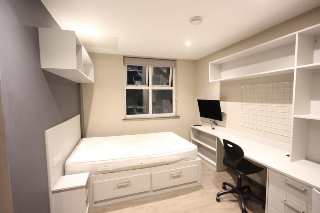 A stylish and spacious double bedroom featuring...