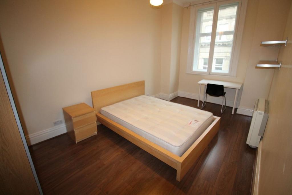 Bright and inviting double bedroom featuring a ...