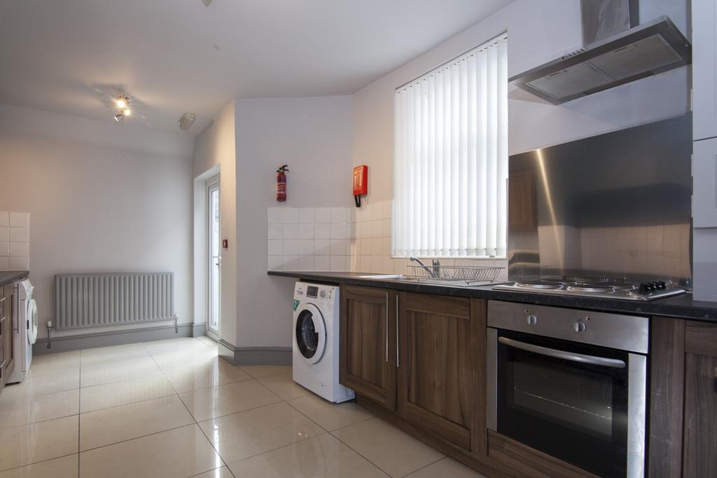 A bright and modern kitchen featuring ample spa...