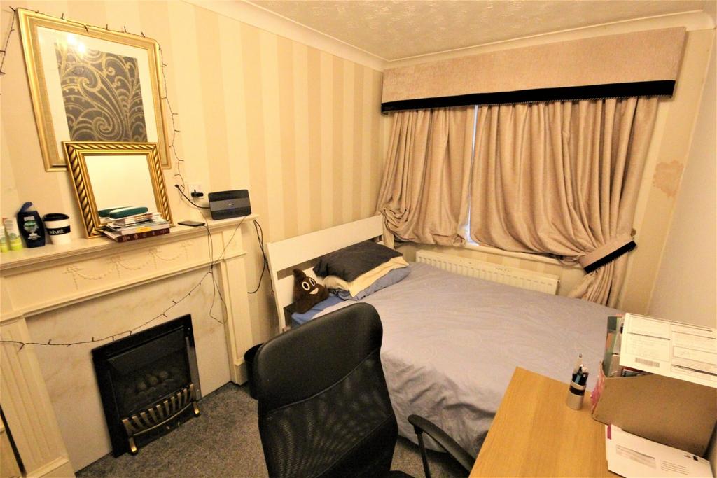 A cozy and inviting double bedroom featuring a ...