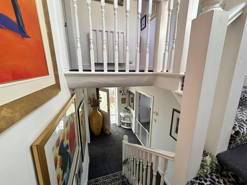 Stairs down to front door