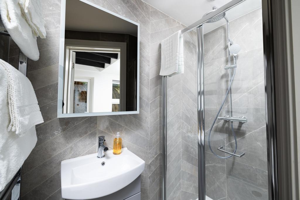 A stylish and modern bathroom featuring a sleek...