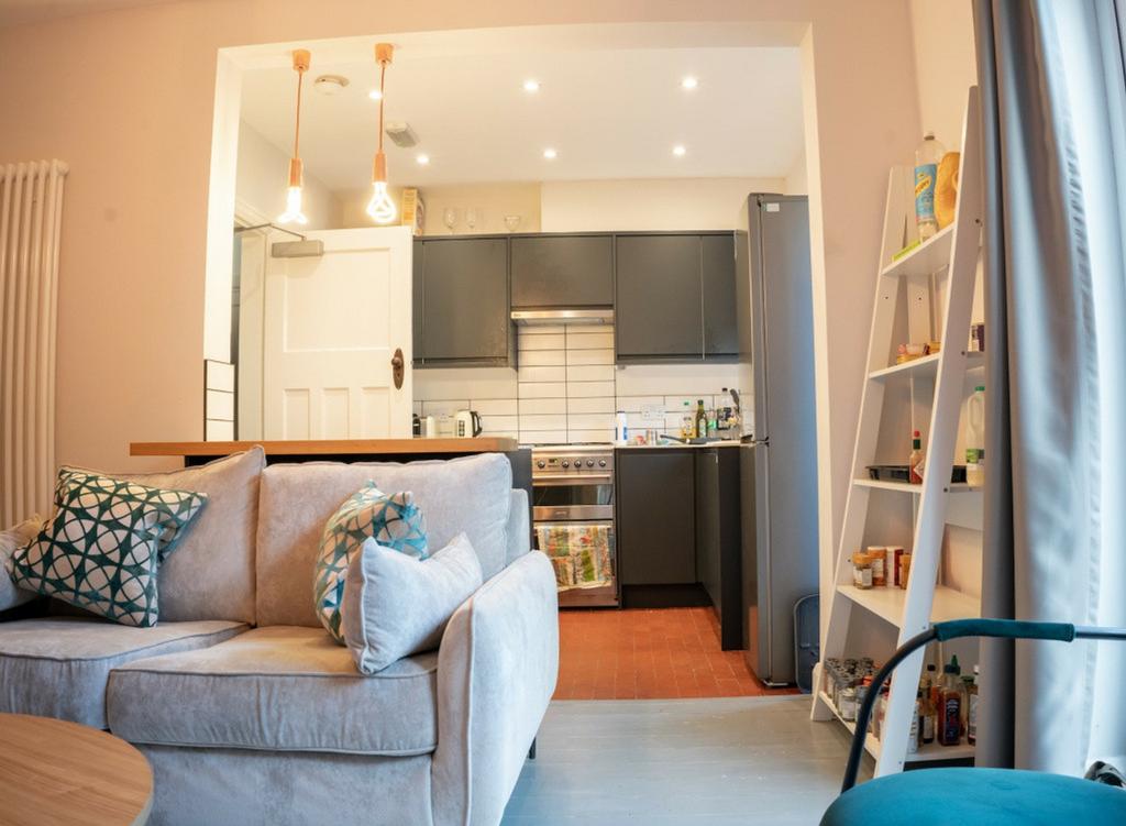 A modern and inviting kitchenette with stylish ...