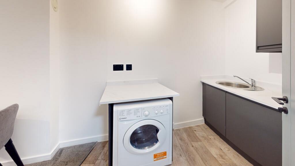 A clean and modern kitchenette with ample space...