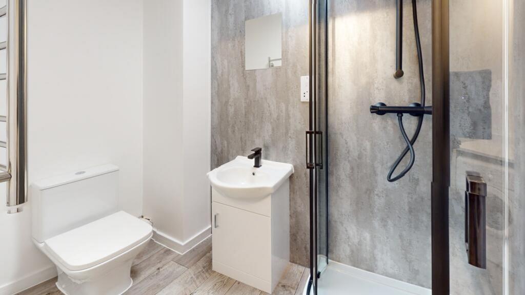 A modern and stylish bathroom featuring a sleek...