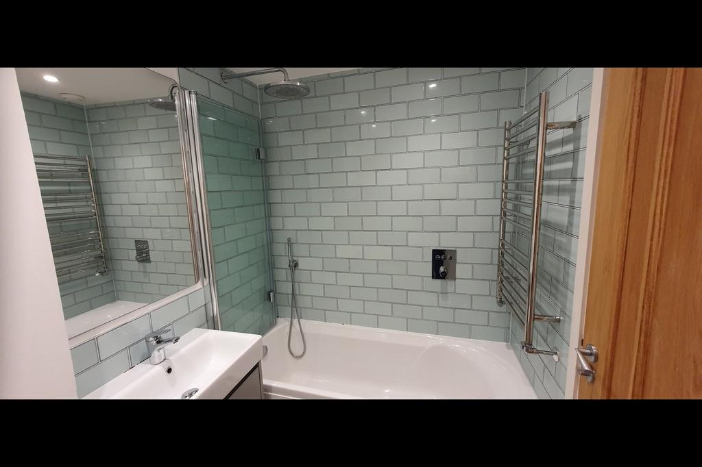 A beautifully designed bathroom suite featuring...