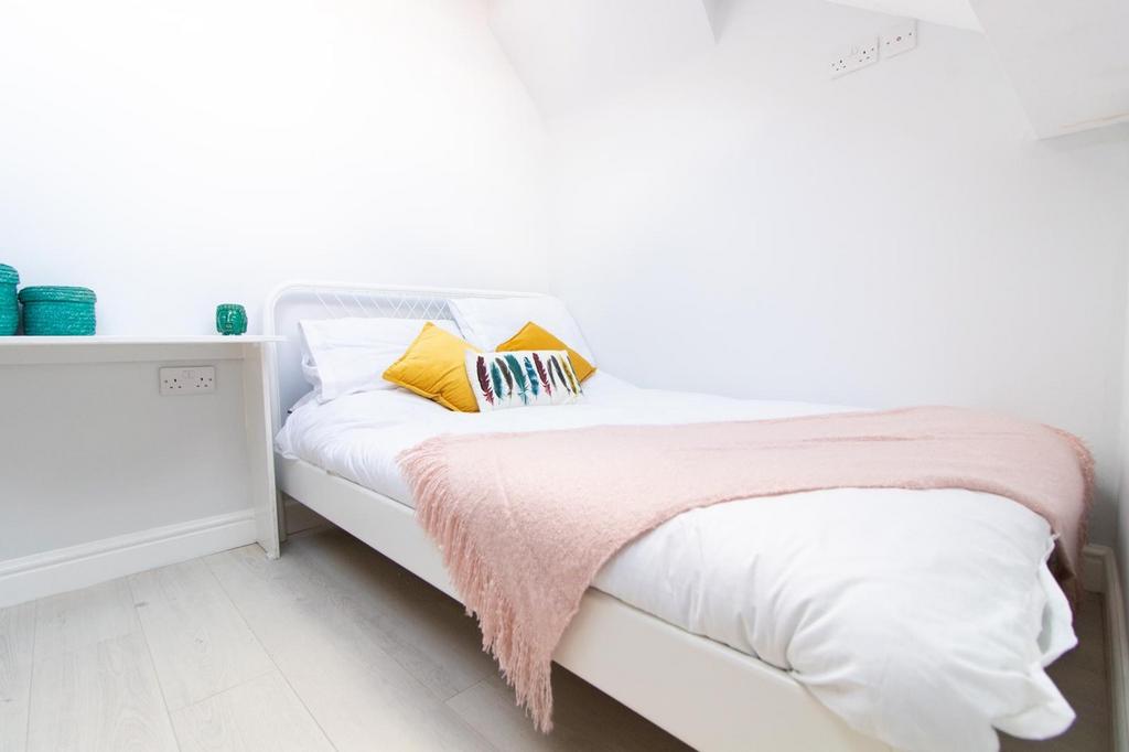 A bright and cozy double bedroom, perfect for s...