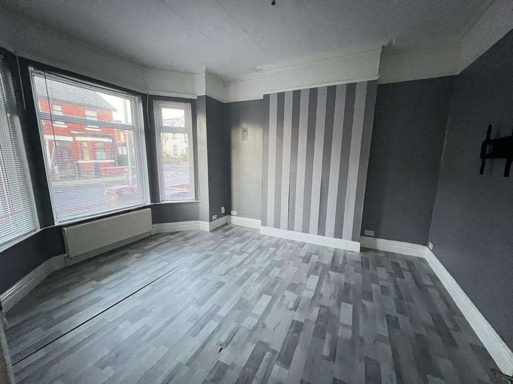 This inviting living room features ample natura...