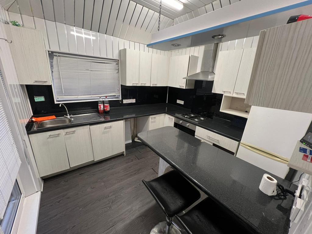 Modern kitchen featuring contemporary cabinetry...