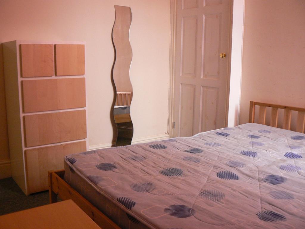 This inviting double bedroom features a comfort...