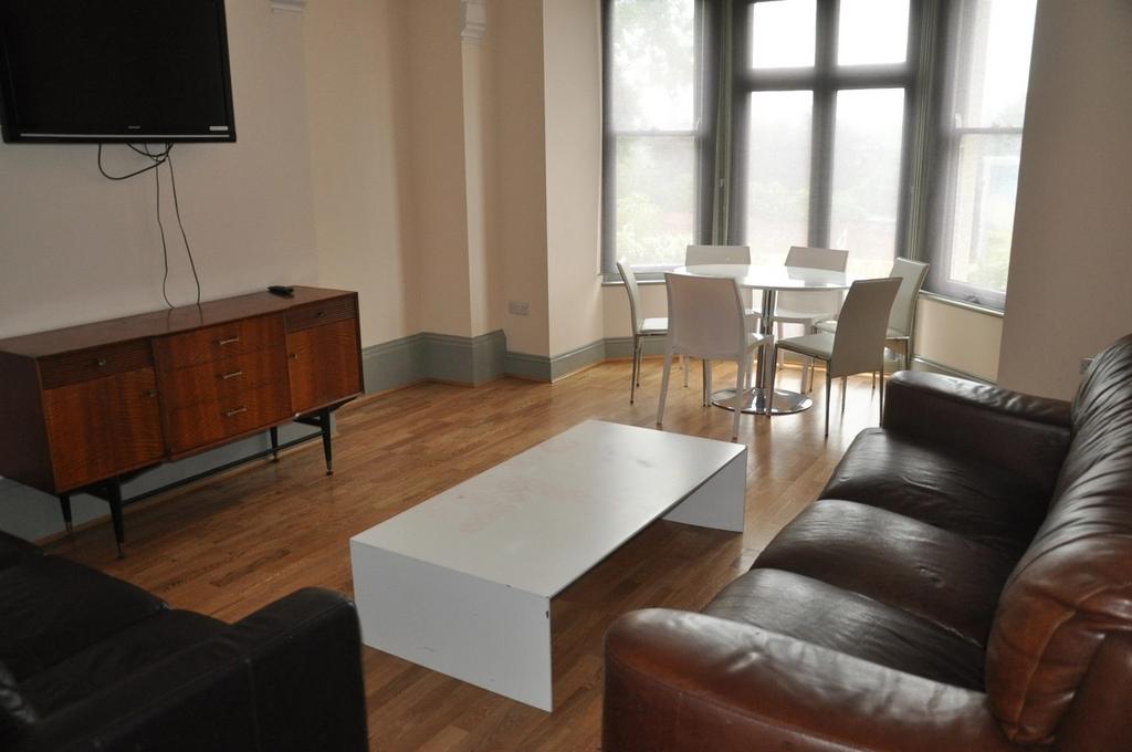 A spacious and inviting modern living room with...