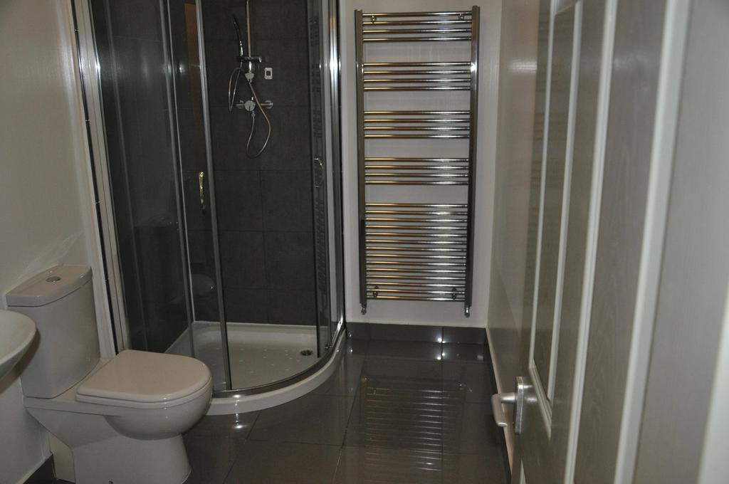 A stylish and modern bathroom featuring a sleek...